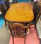 Oval Dining Table With 1960s Spanish Revival Solid Pecan Wood and Black Vinyl Dining Chairs - Set of 5