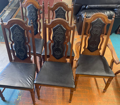 Oval Dining Table With 1960s Spanish Revival Solid Pecan Wood and Black Vinyl Dining Chairs - Set of 5