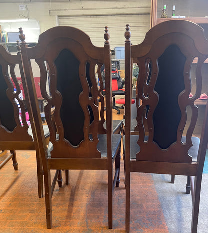 Oval Dining Table With 1960s Spanish Revival Solid Pecan Wood and Black Vinyl Dining Chairs - Set of 5