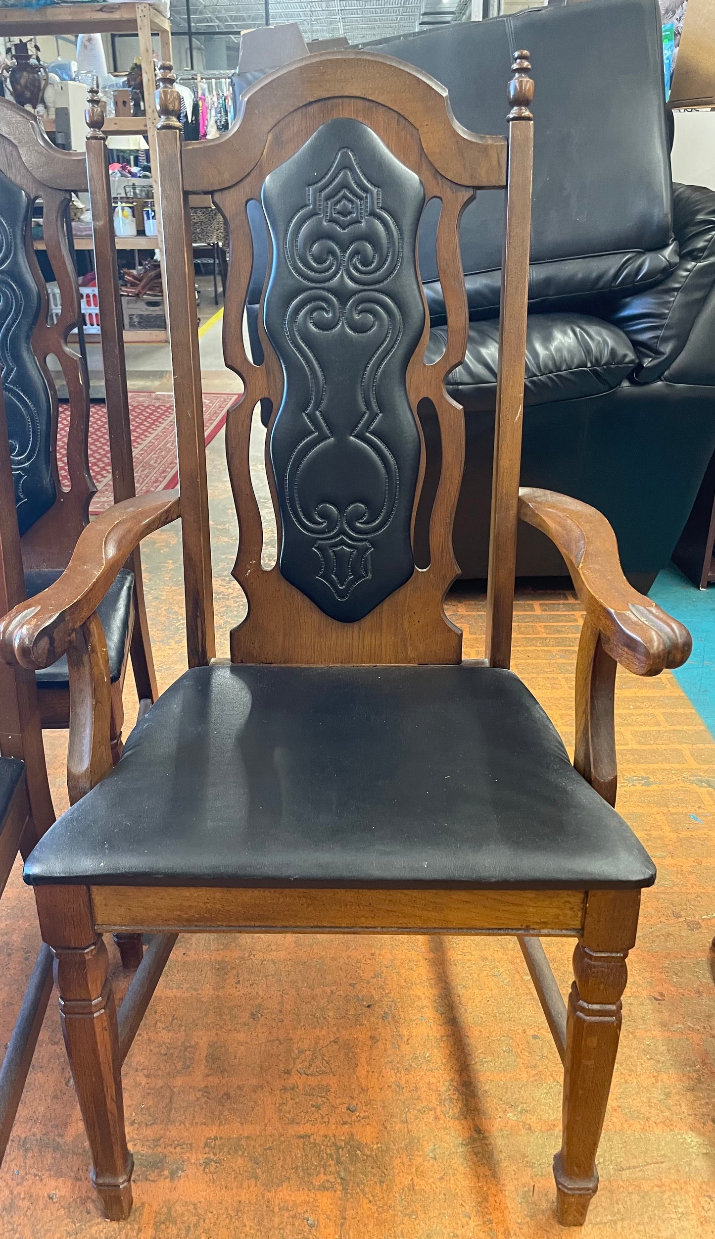 Oval Dining Table With 1960s Spanish Revival Solid Pecan Wood and Black Vinyl Dining Chairs - Set of 5